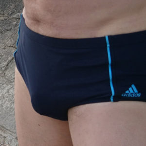 invisible penis cage in swimming trunks